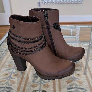 Elegant Brown Heeled Boots with Black Chain Accent